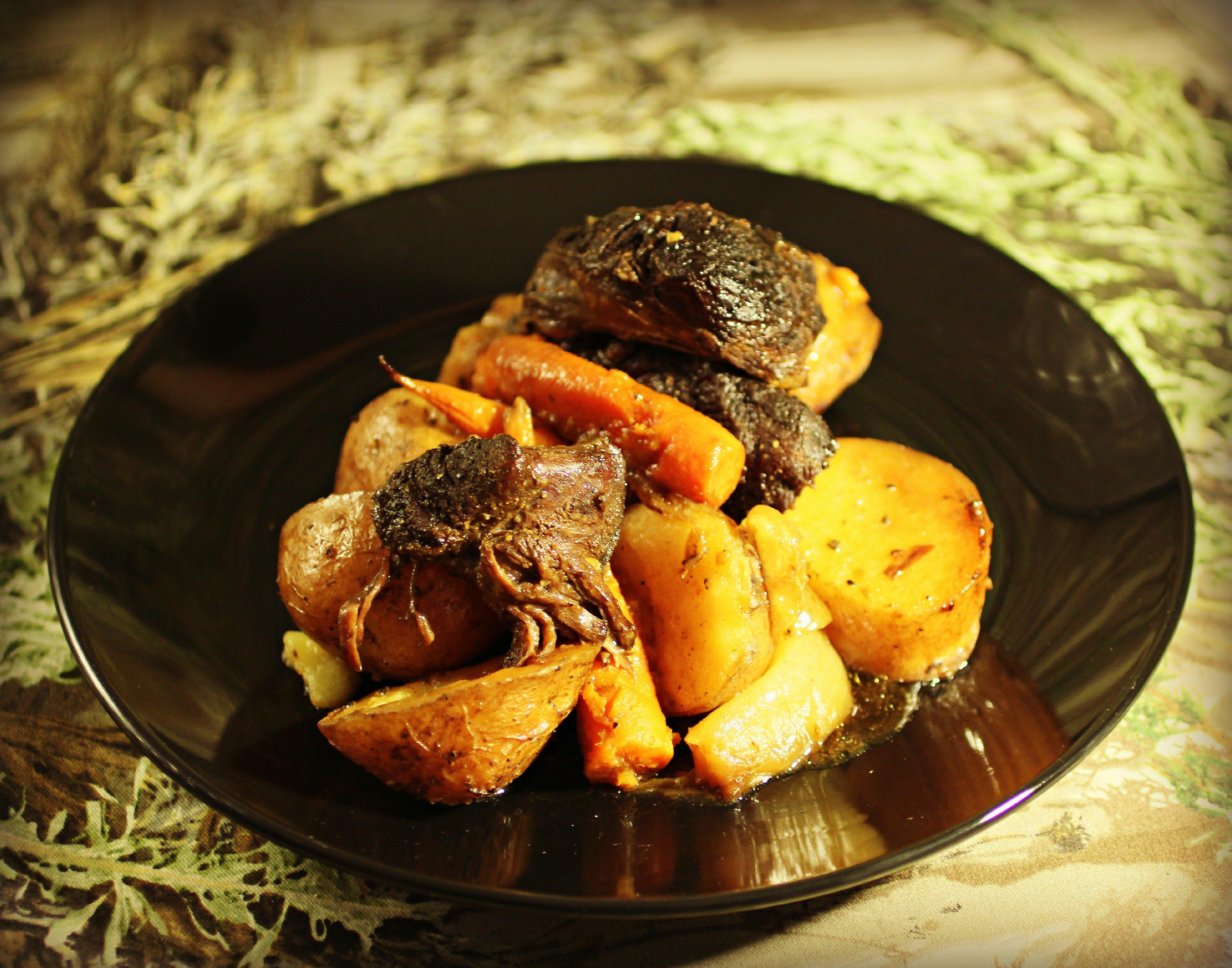 Slow roasted elk round with carrots, potatoes and onions.