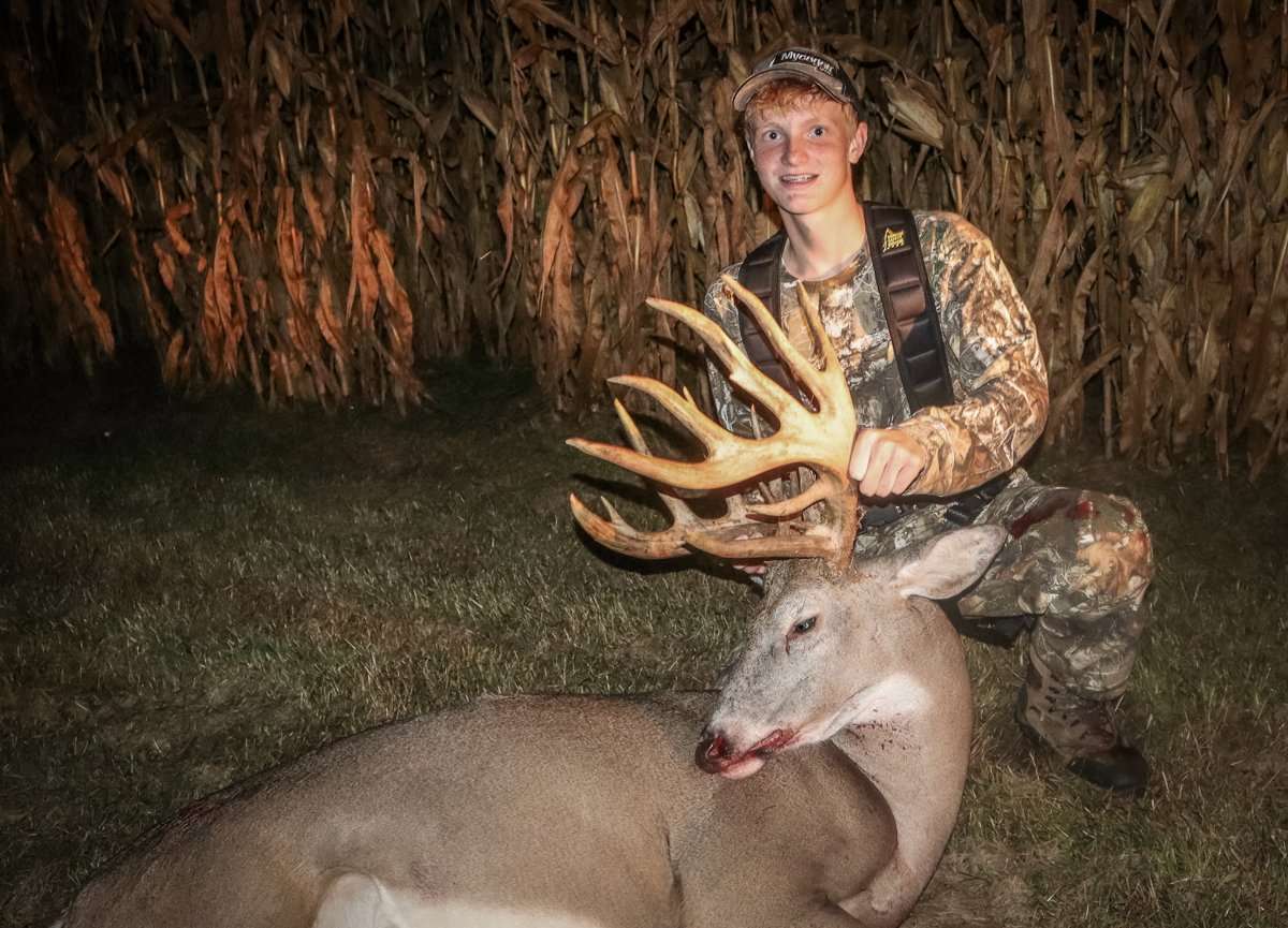 Ethan and his father Kent tucked in the same tree, and Ethan settled in with his crossbow. This buck came out soon after. (Hurlburt photo)