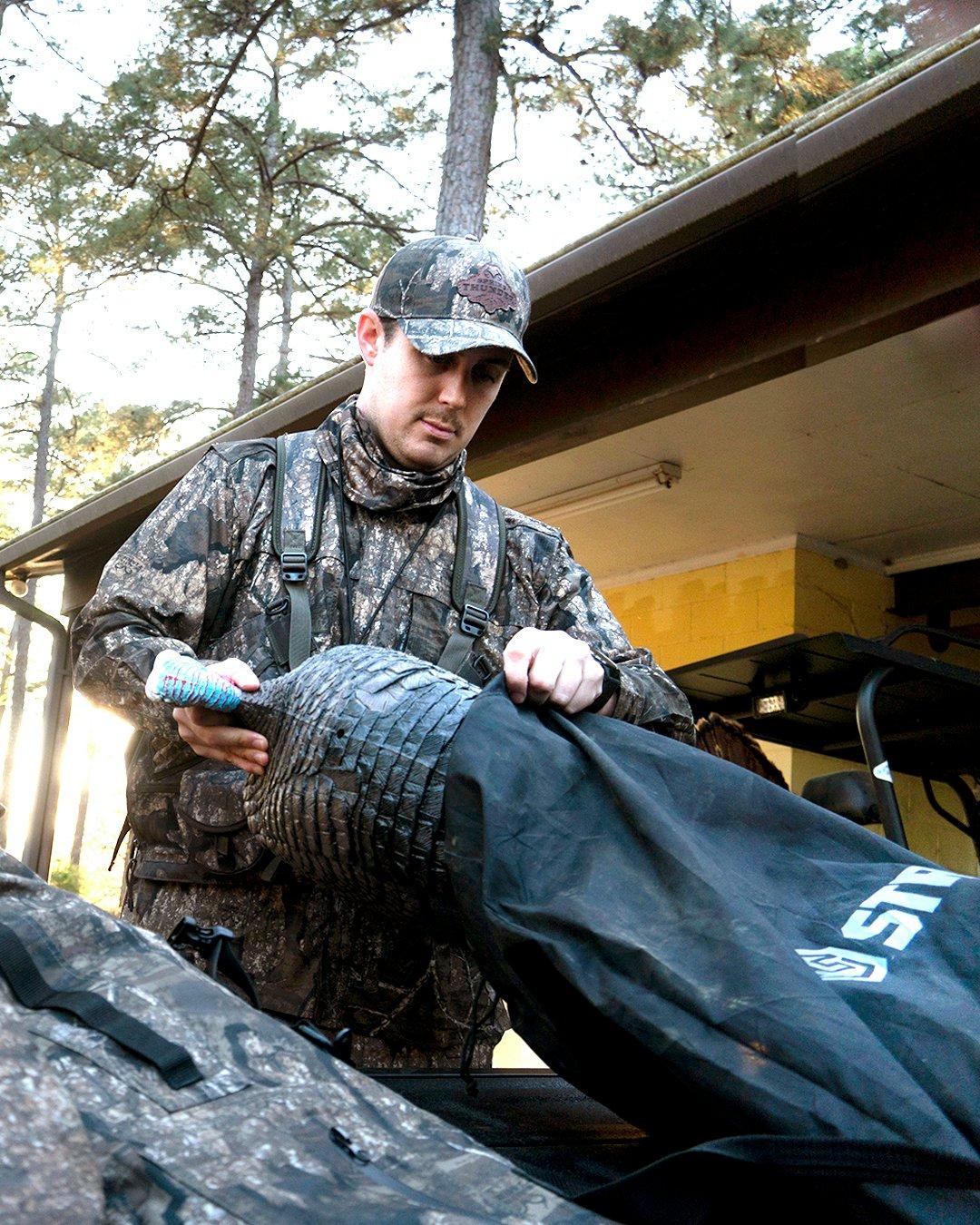 Realtree's Tyler Jordan loads a decoy into his four-wheeler before the hunt. Image by Realtree/Tyler Jordan