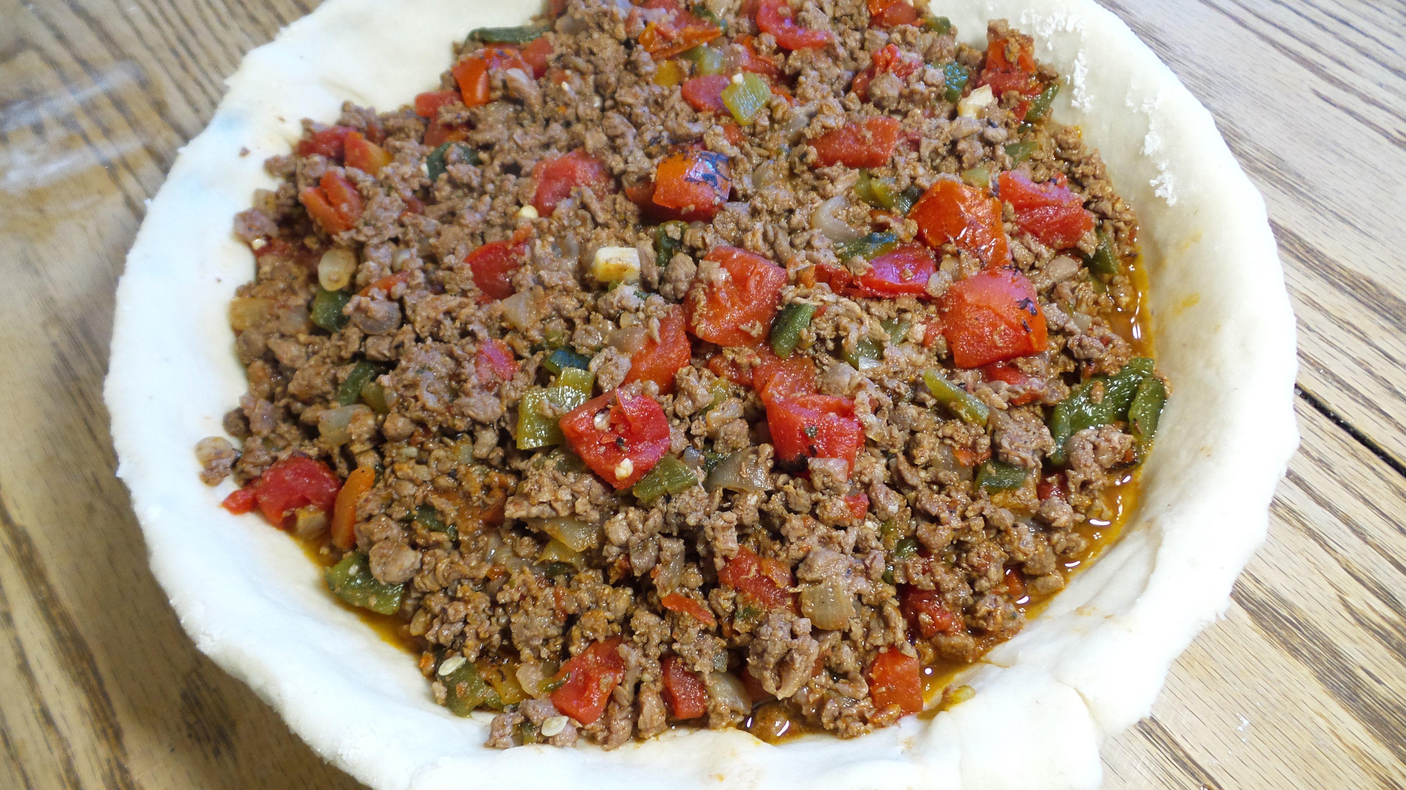 Fill the pie crust three quarters of the way full with the meat mixture.