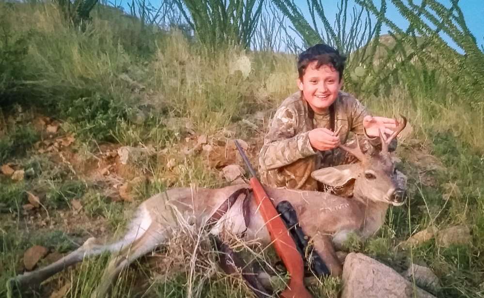 Zachary Brown shows off his first deer; a great coues whitetail. (Nathan Brown photo)