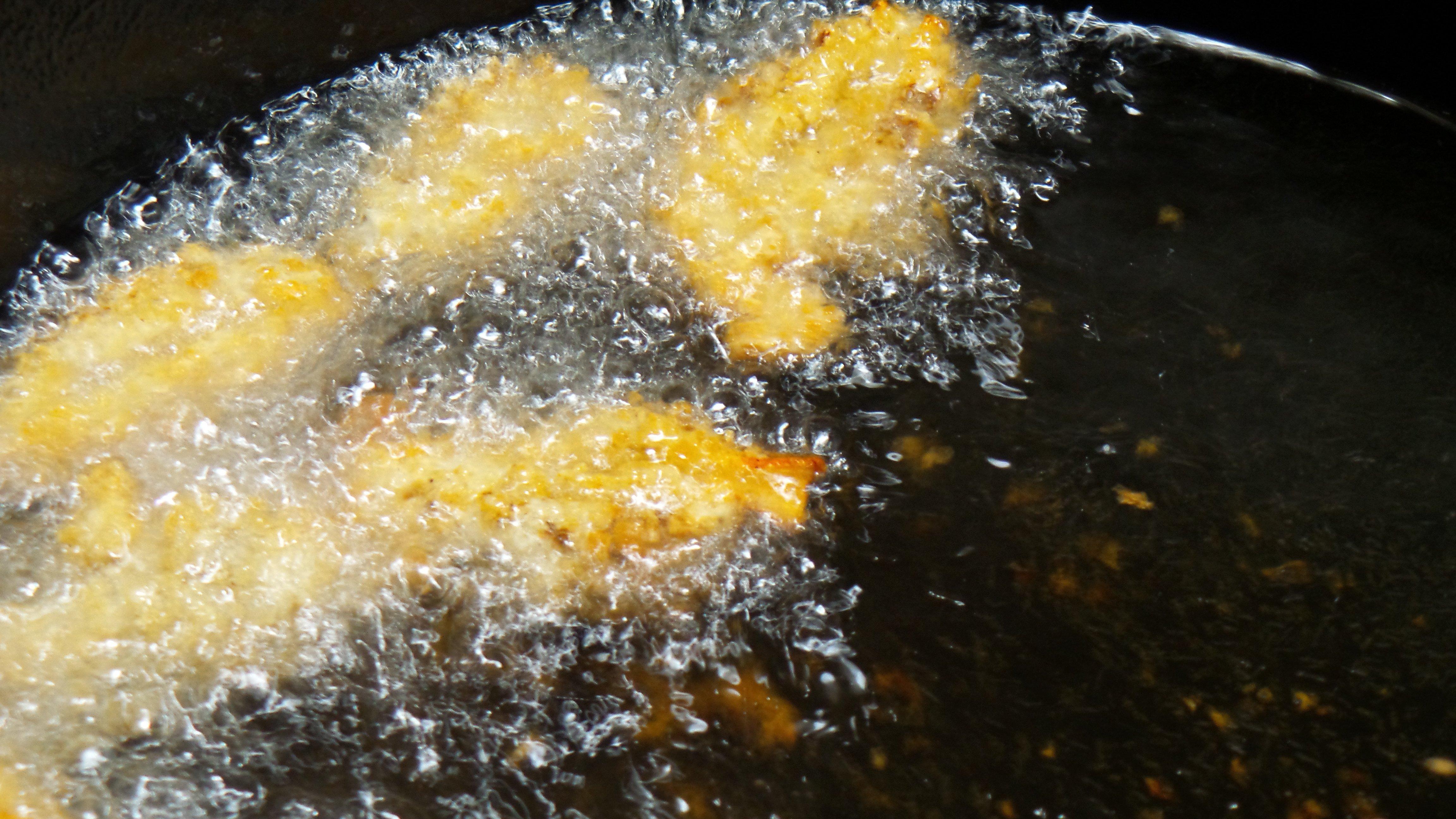 Fry the mushrooms until they turn golden brown and float to the surface.