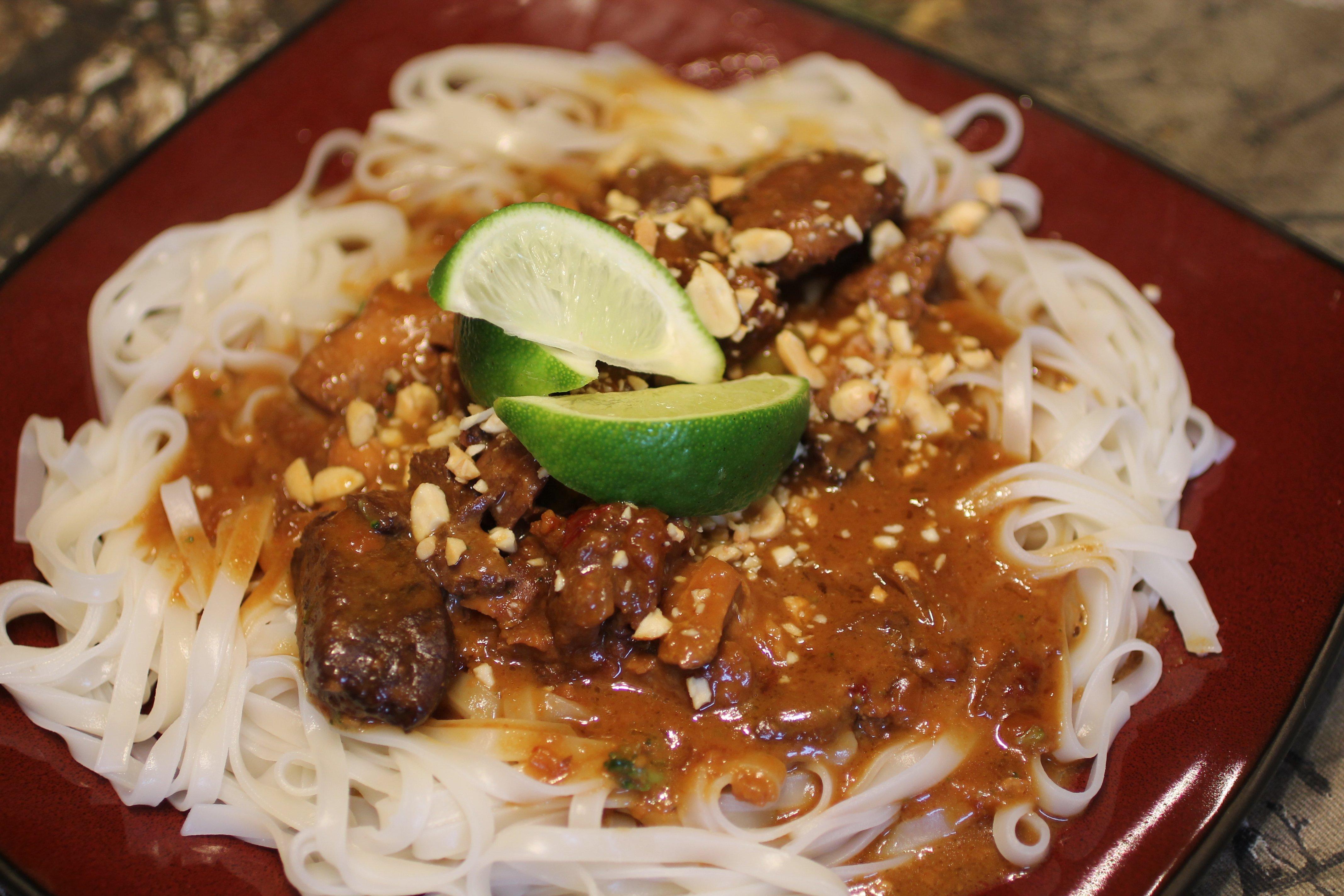 Garnish with crushed peanuts and fresh lime.