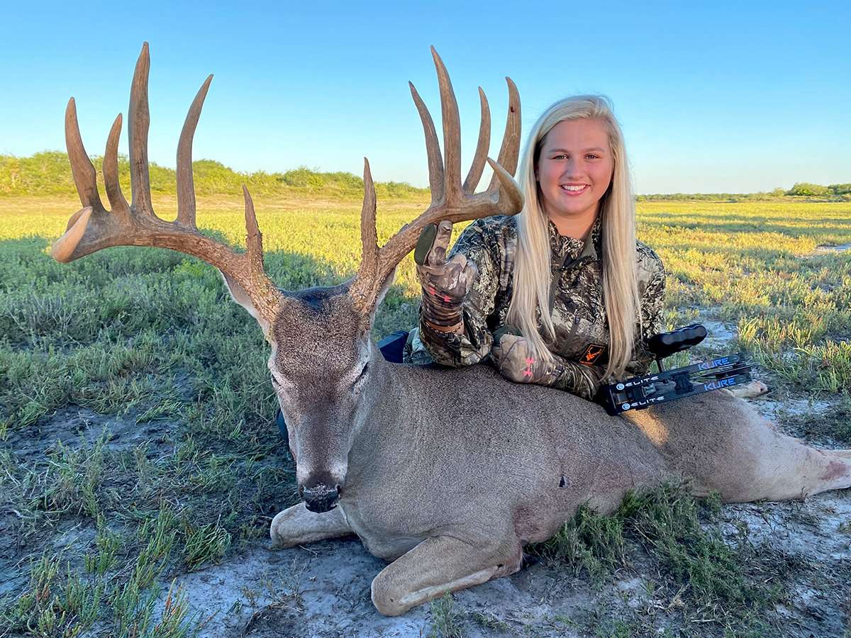 Georgia-Kate McFerrin poses with her biggest buck ever. It's a fine Texas deer. Image by Legends of the Fall