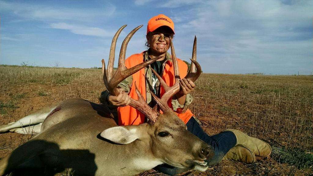 Grace Shively, 14, with her first deer kill ever, a 160-inch Kansas buck.