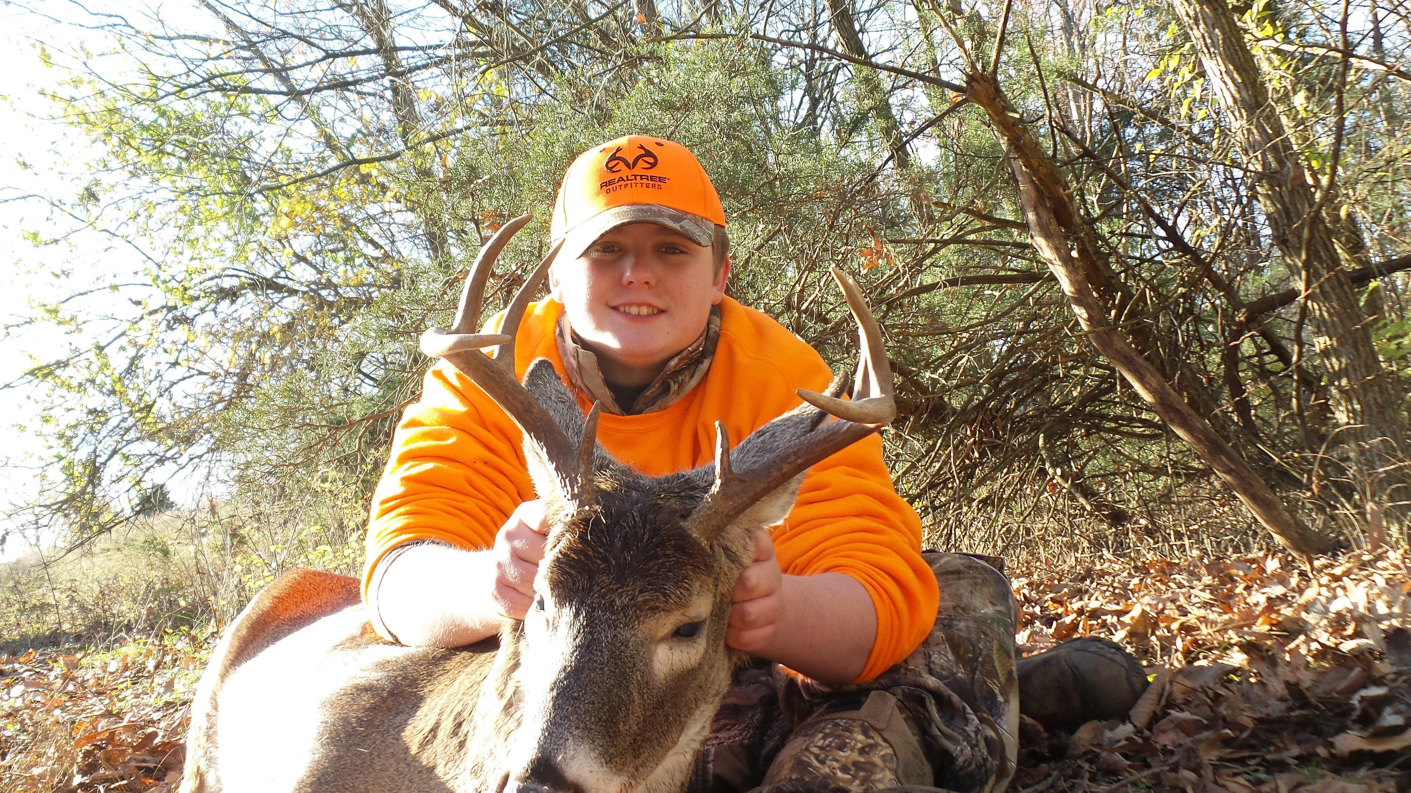 Hunter with one of the three whitetails he has taken so far this season.