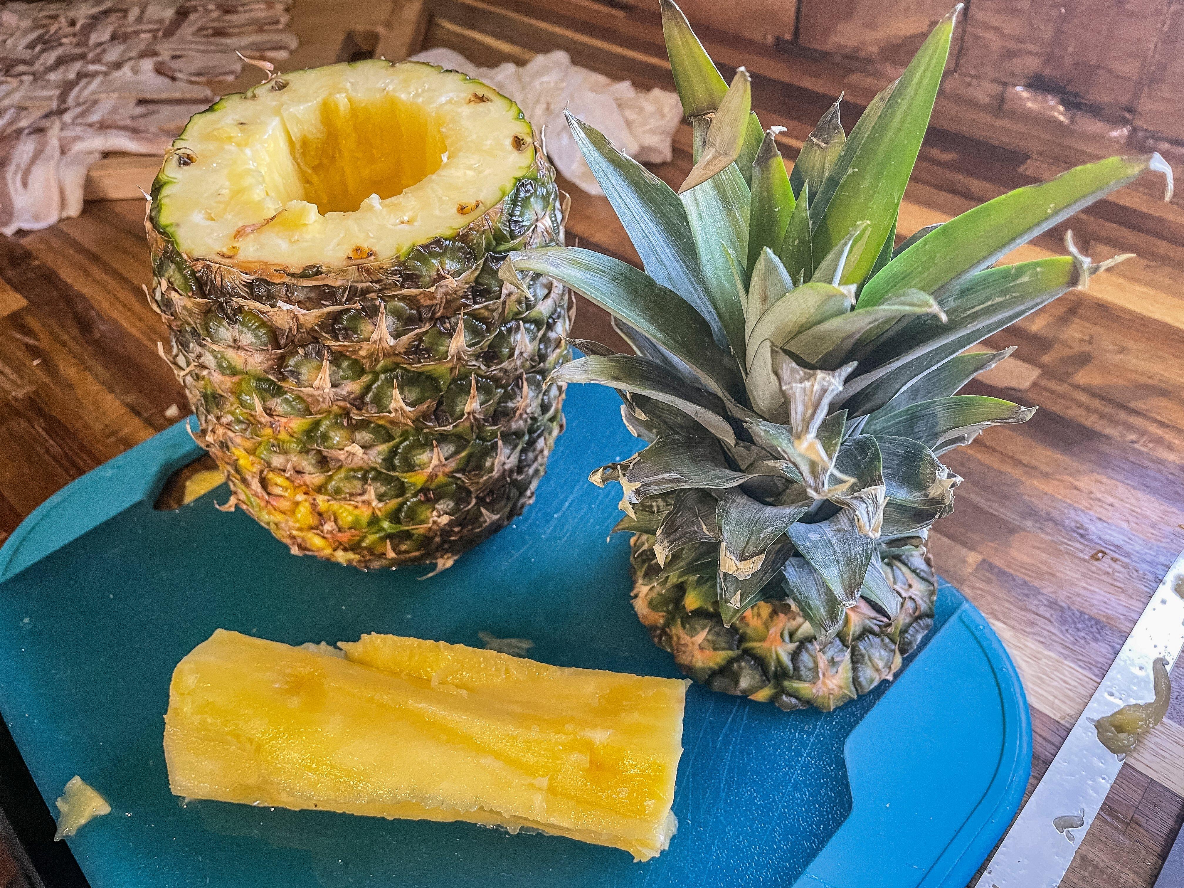 Remove the top and core the pineapple.