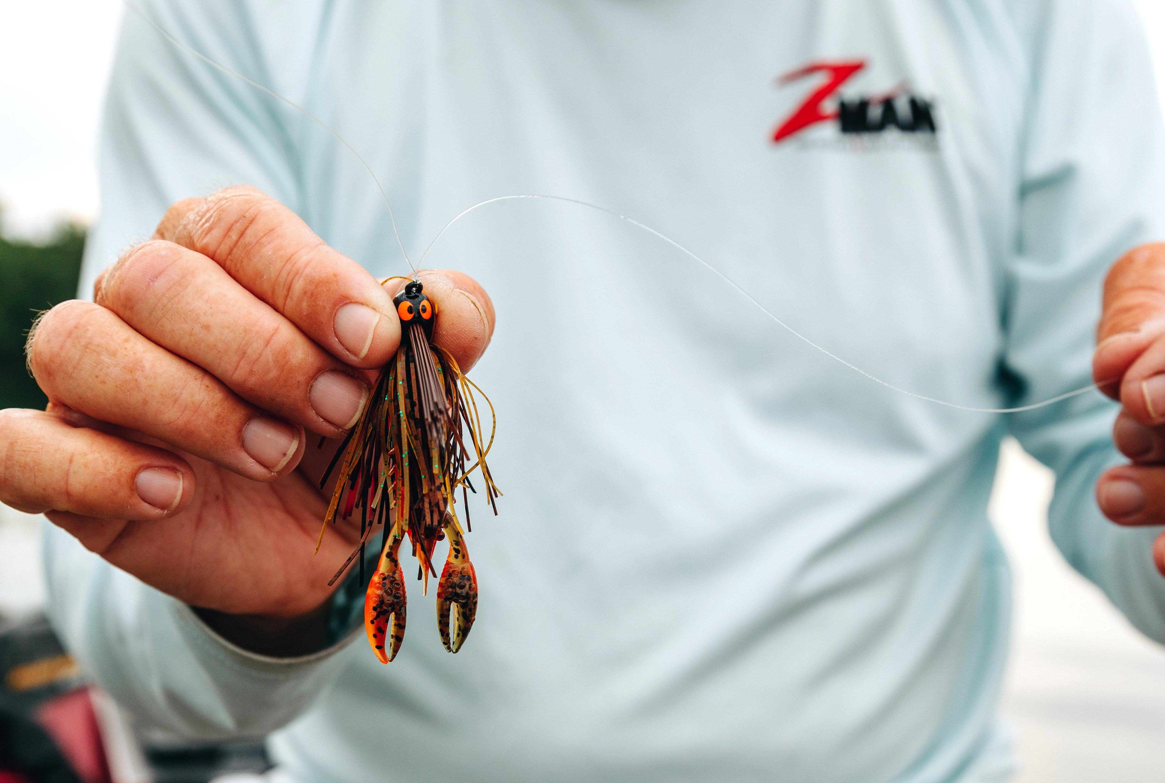 Jigs are the best bait for all species of bass this time of year. Downsize to a finesse model to get the most bites. Image by Millennium Promotions