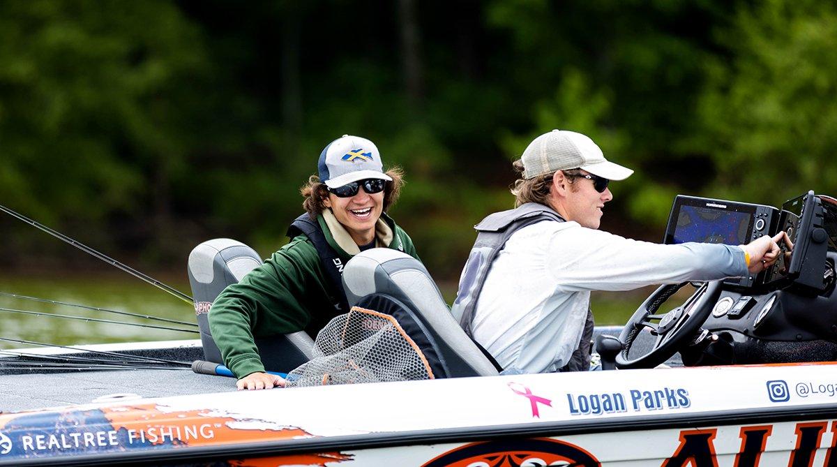 Logan Parks points the team's bass boat toward what they hope to be plenty of awaiting bass. Image by Brandon Fien