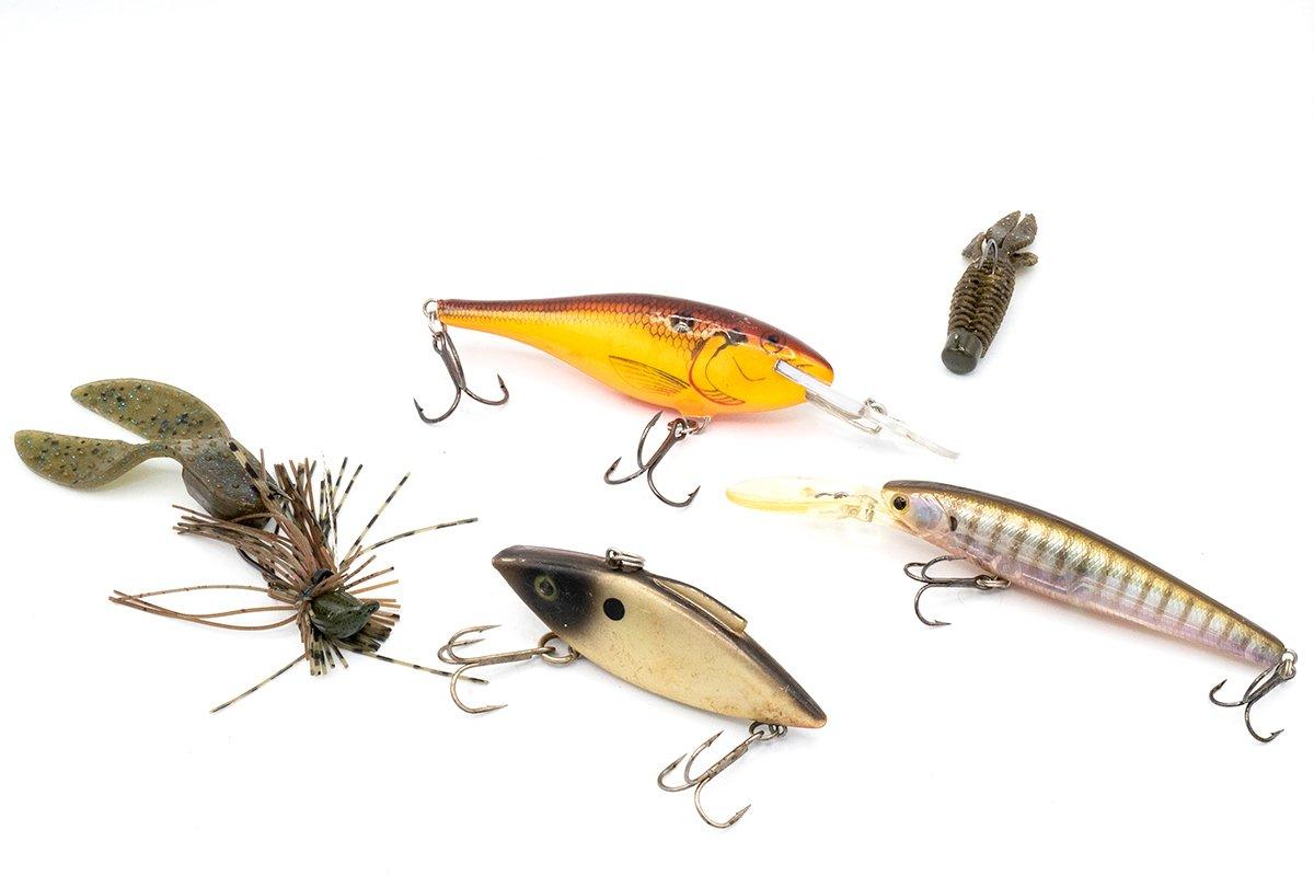 A Ned-rigged plastic, lipless crankbait, Shad Rap, jerkbait, and jig round out the author's picks for early spring lures. Image by Joe Balog 