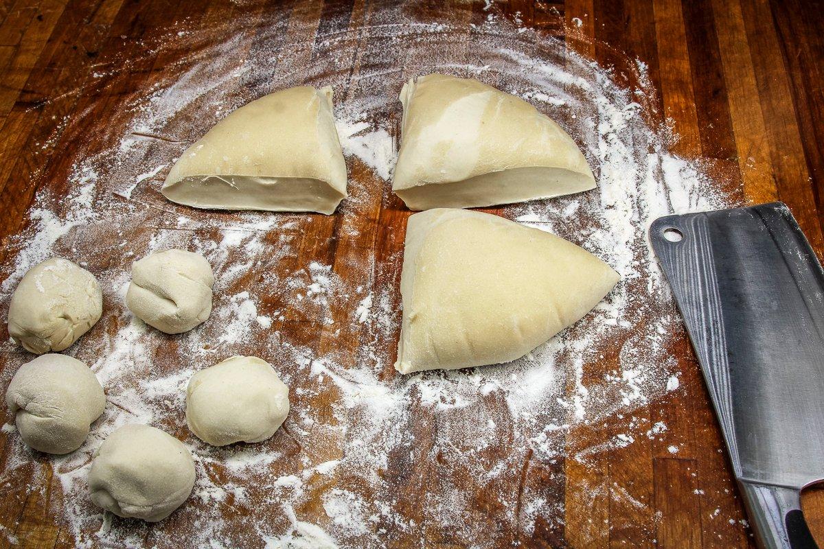 Divide the dough into quarters, then divide each quarter into 4 or 5 equal sections.