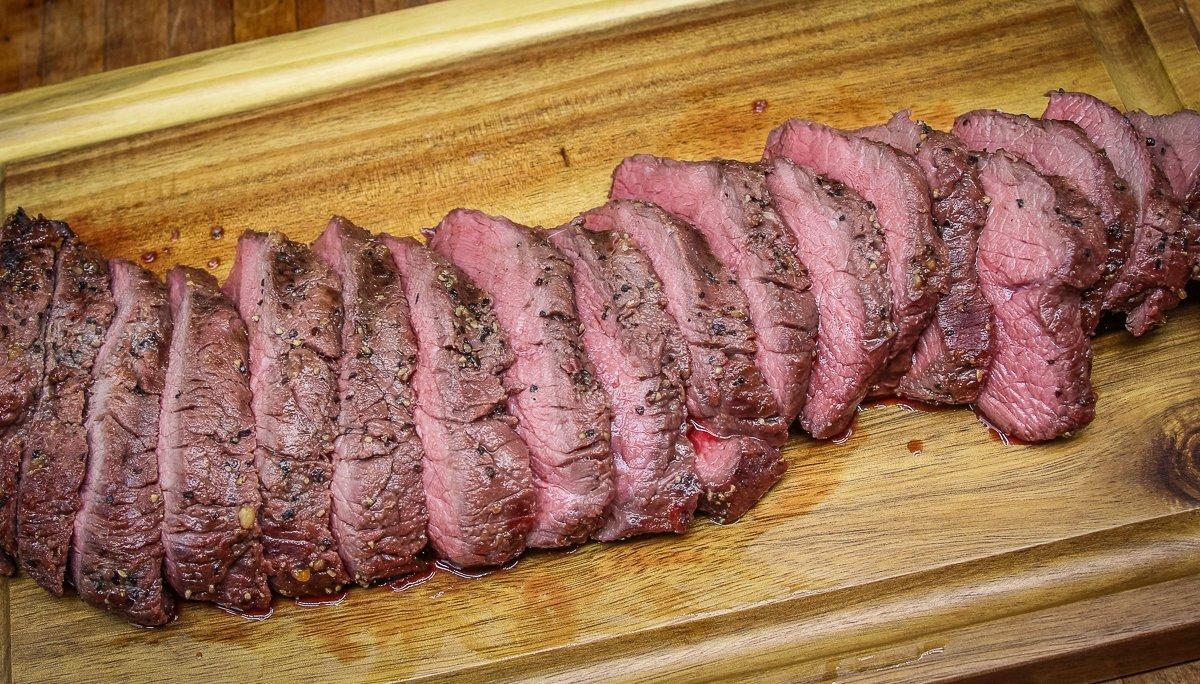 Grill the backstrap to medium-rare and slice against the grain for tenderness.