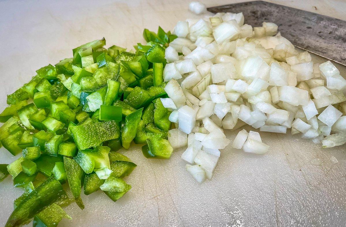 Dice an onion and a bell pepper to add to the ground venison.