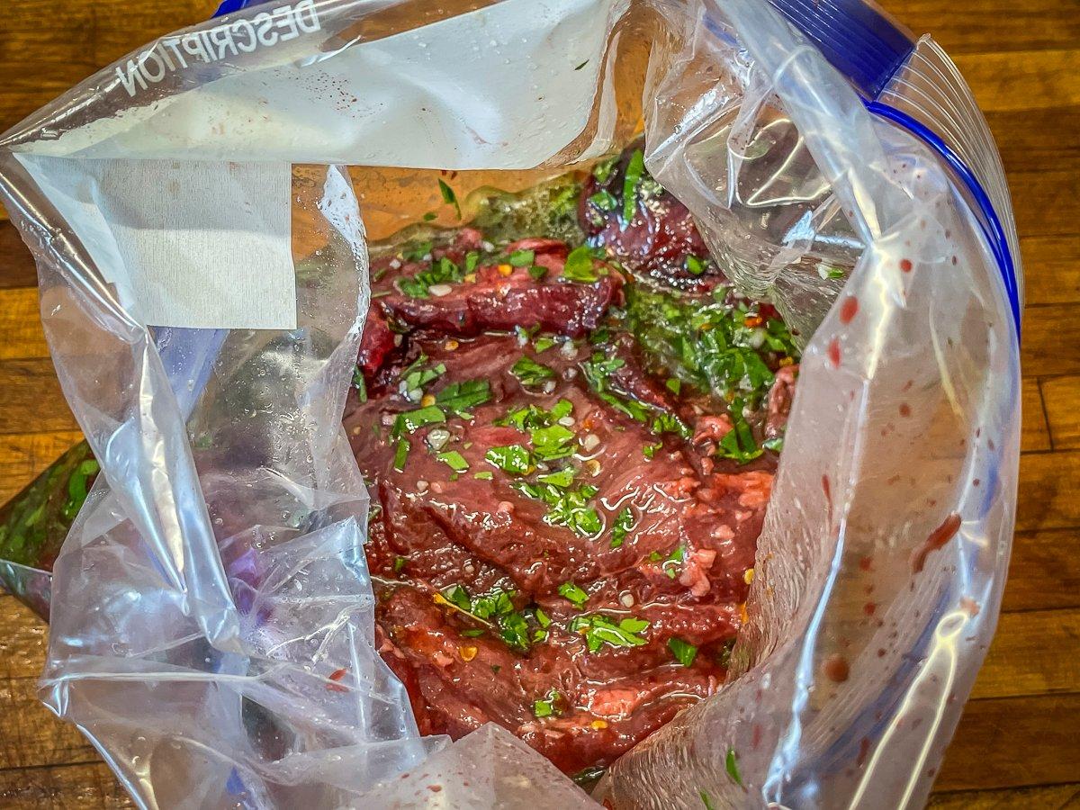 Marinating the meat both adds flavor and tenderizes what can otherwise be a tougher cut of meat.