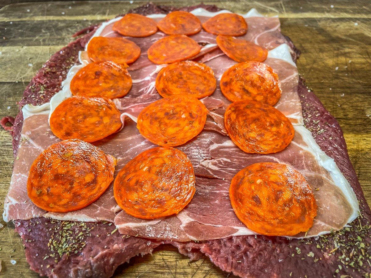 Layer on prosciutto and pepperoni or your choice of cured meats.
