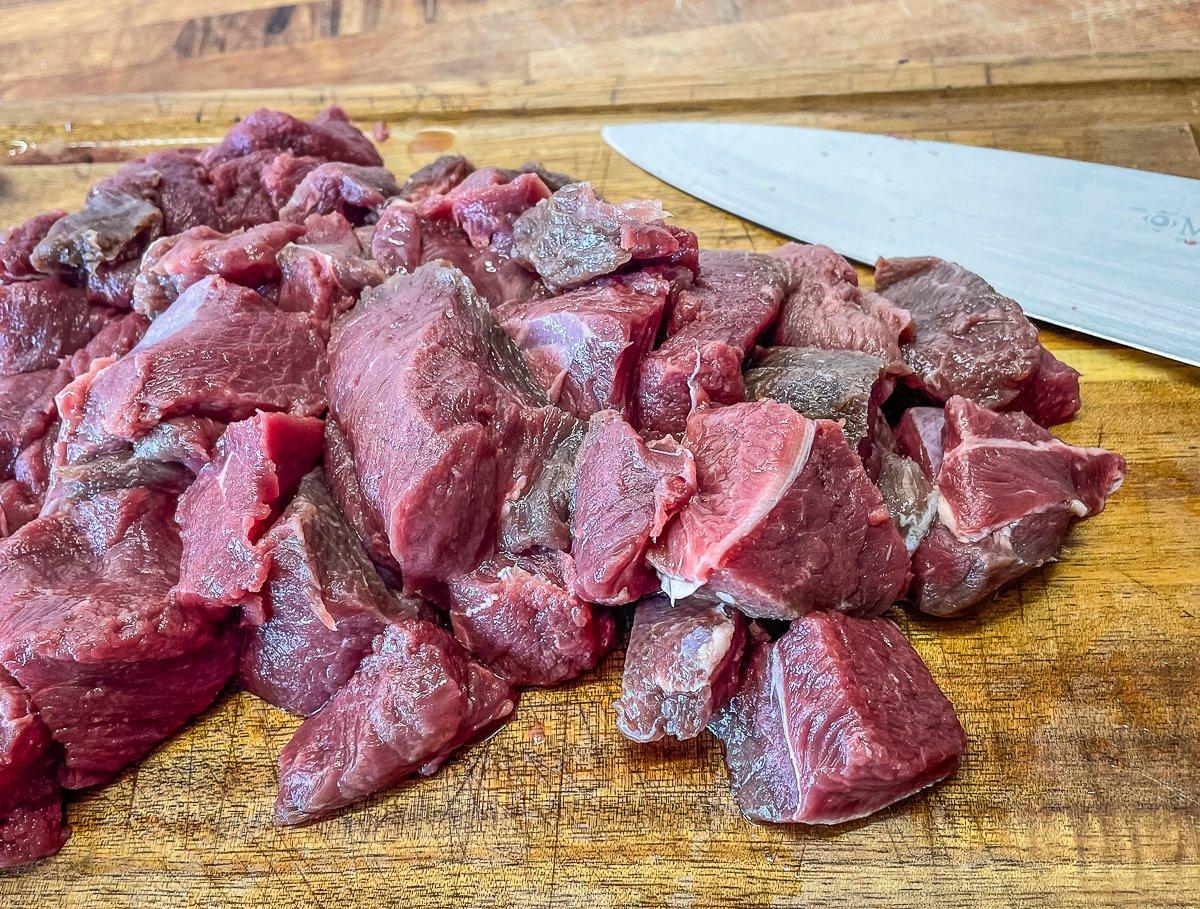 Cut the venison roast into 1-inch cubes.