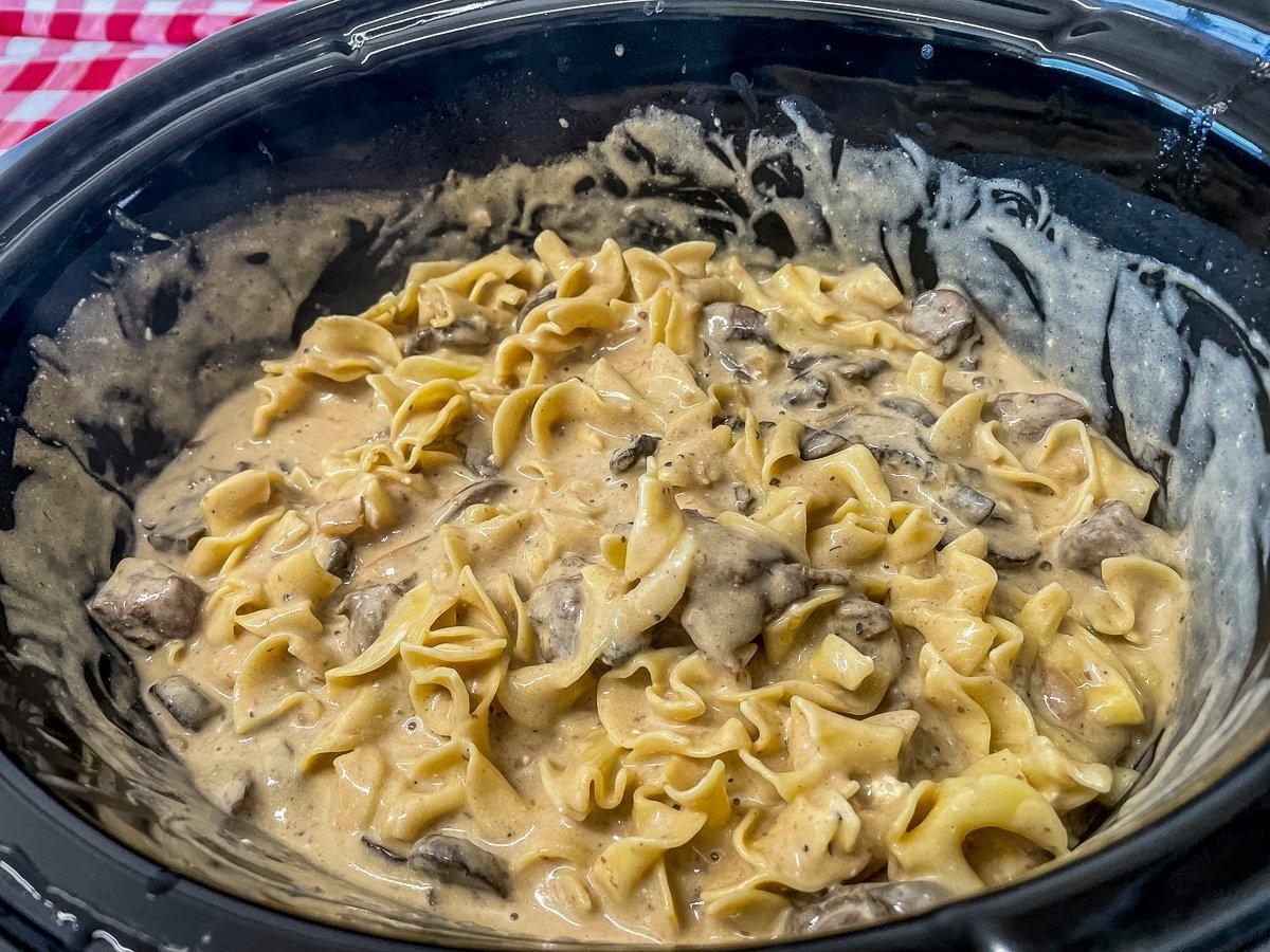 Stir the cooked egg noodles into the slow cooker just before serving.