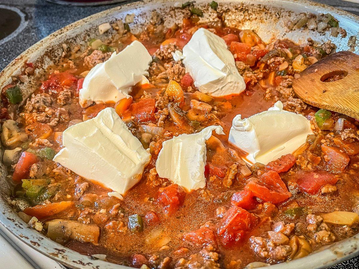 Stir in the cream cheese until it melts.