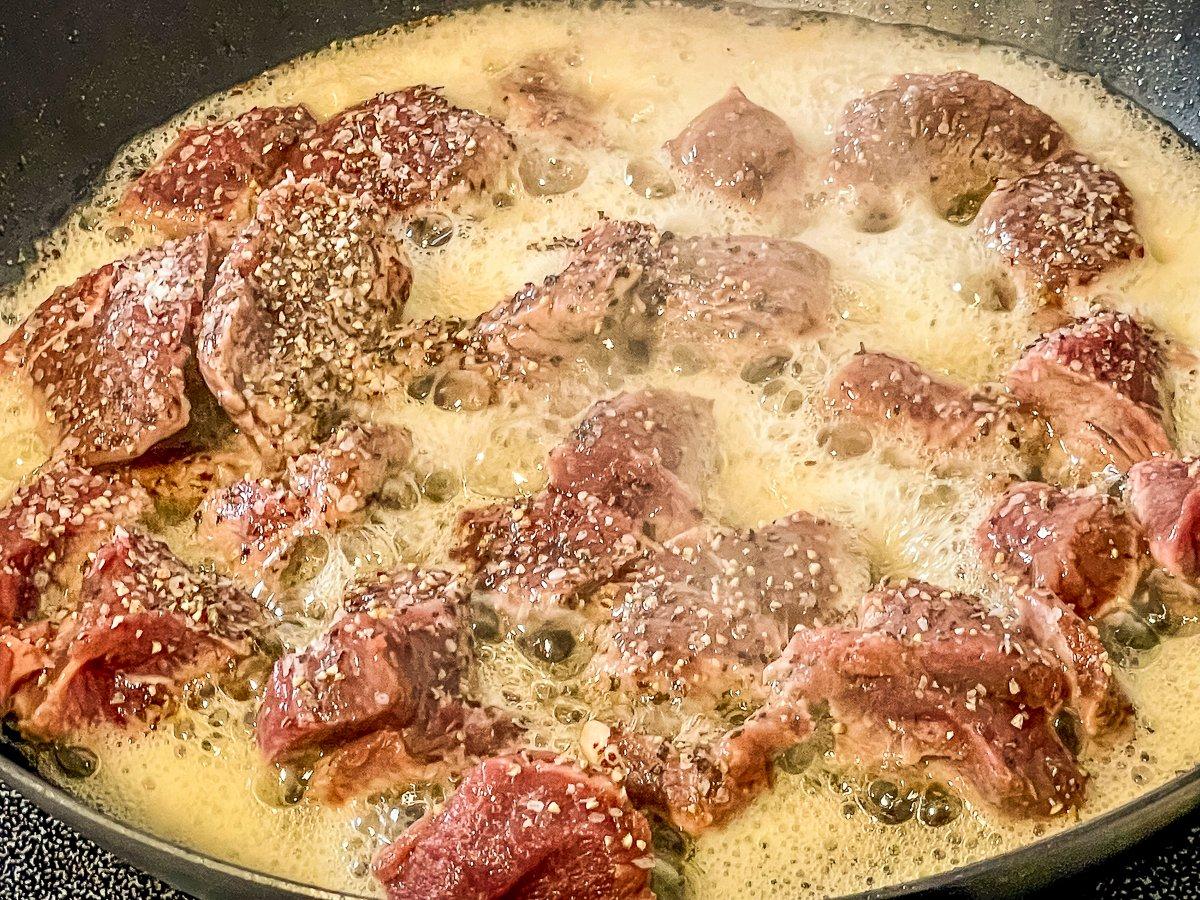 Brown the backstrap in the clarified butter.