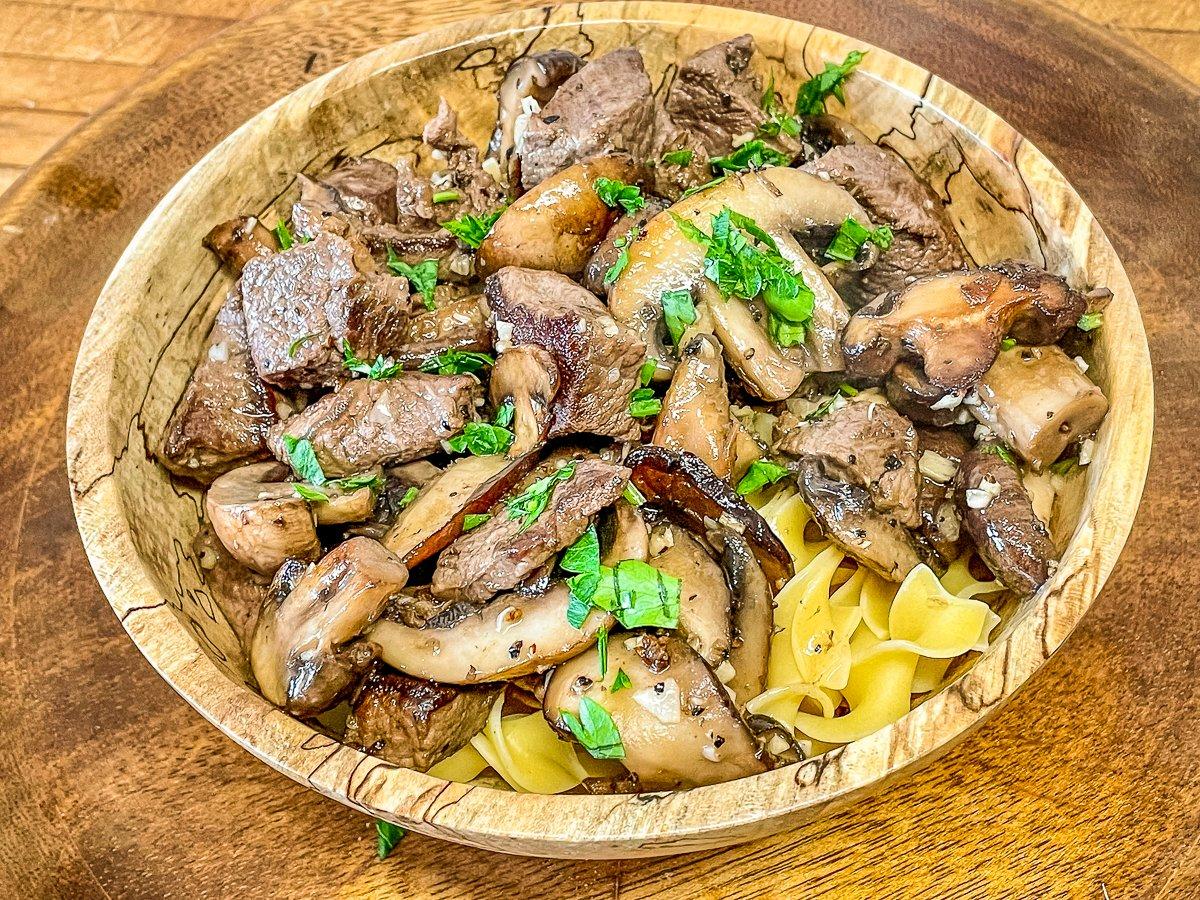 You can serve the backstrap bites and mushrooms in a rich garlic-butter sauce over egg noodles.