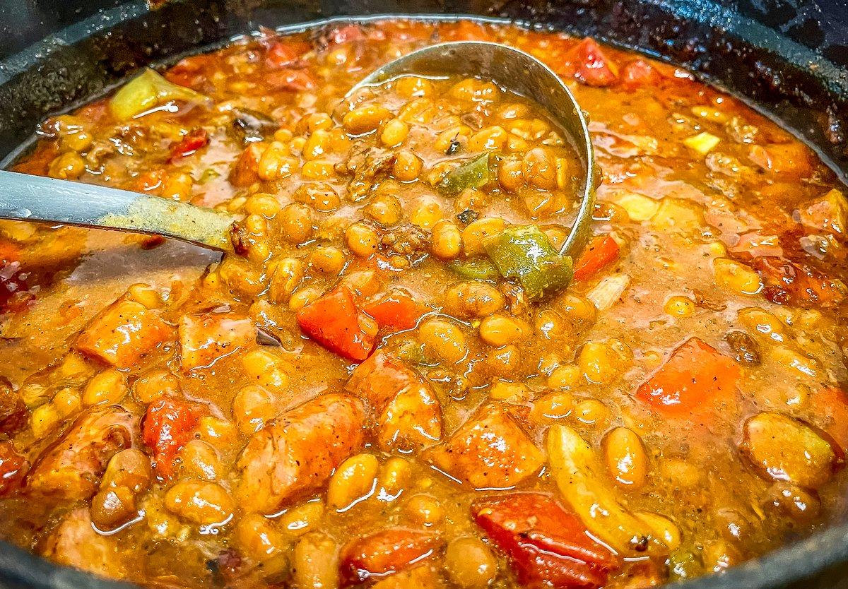 Adding a few ingredients and the flavor of wood smoke to canned baked beans elevates them to a new level of goodness.