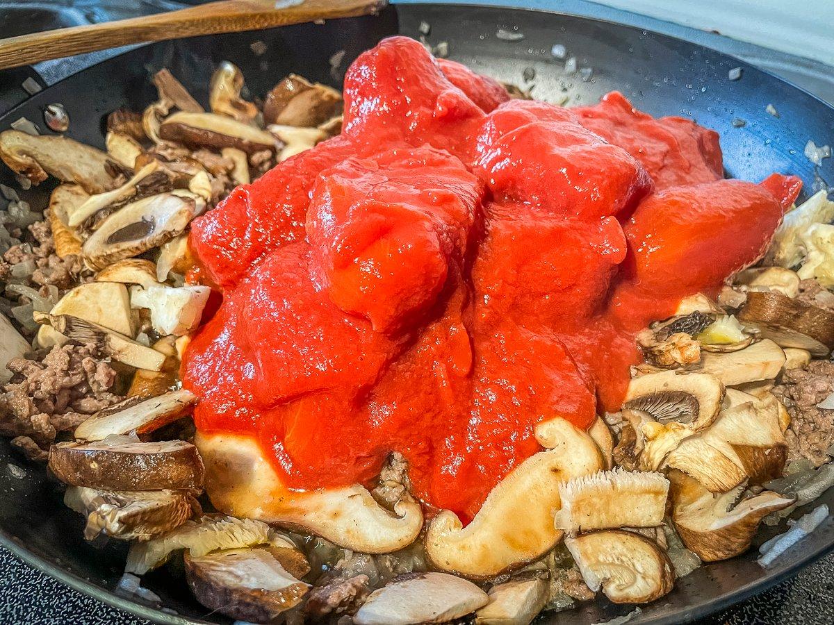 Brown the venison and mushrooms, then add the other sauce ingredients and simmer.