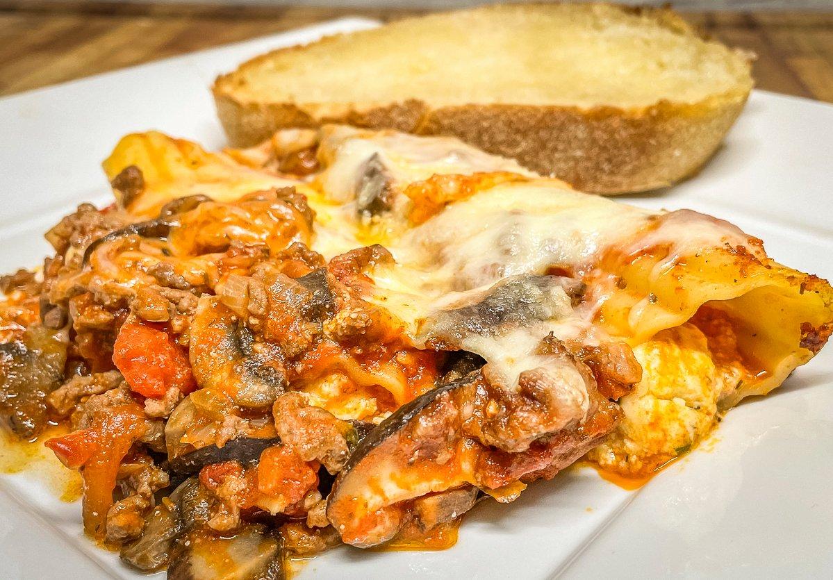 Serve the manicotti with garlic bread and a salad.