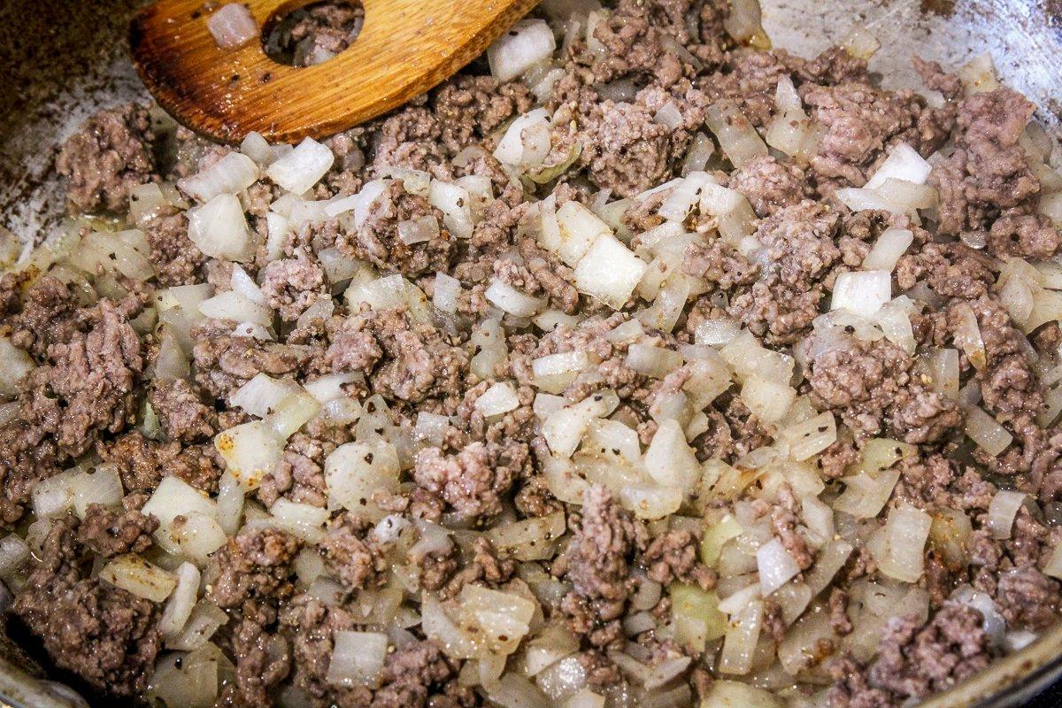 Brown the ground venison and chopped onion together.