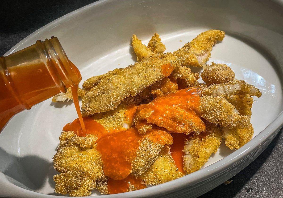 Drizzle the fish with your favorite Buffalo wing sauce.