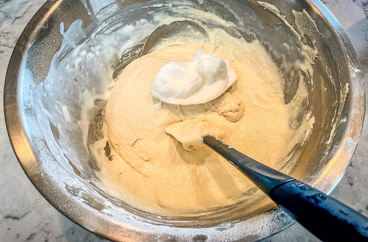 Gently fold the beaten egg whites into the batter.