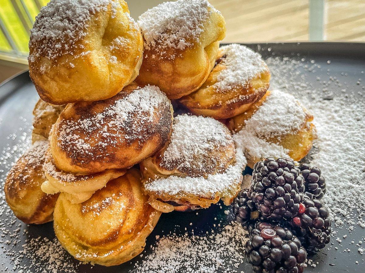 Top the aebleskivers with powdered sugar, honey, or maple syrup.