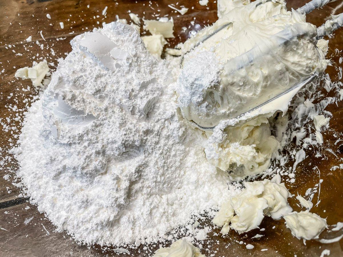 Mix the powdered sugar into the softened cream cheese.