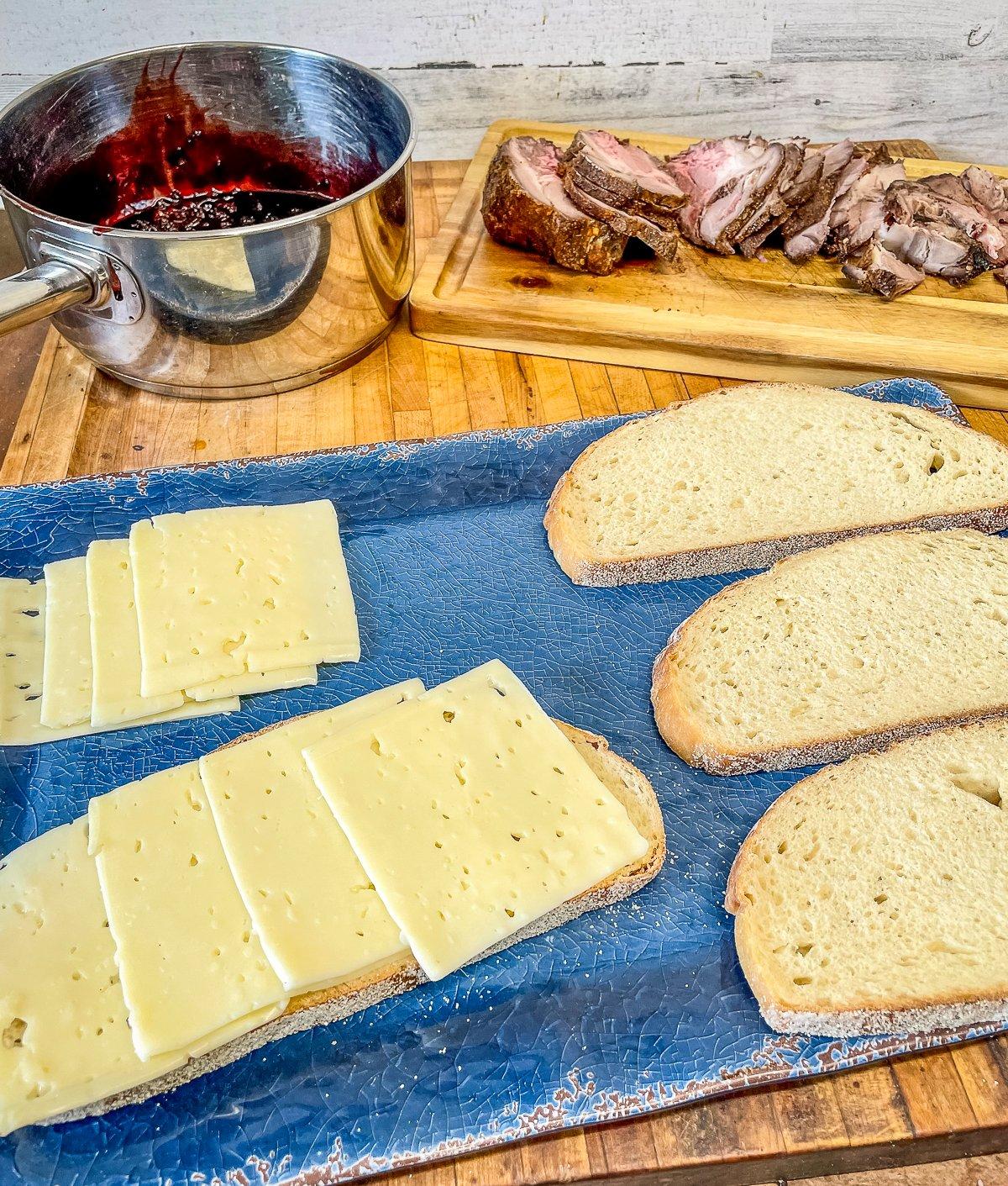 Layer the bread with cheese to prevent the sauce from soaking through. 