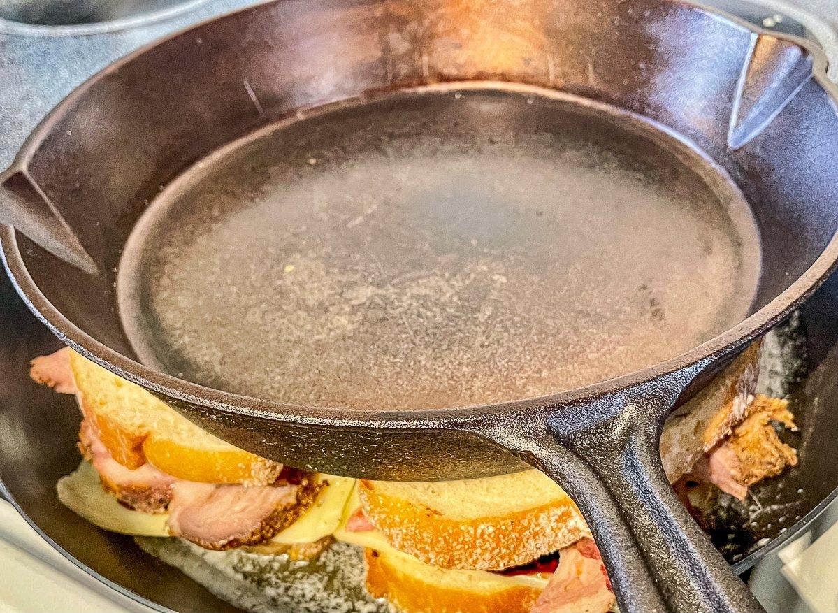 Use a bacon press or an extra skillet to press the sandwiches as they cook.
