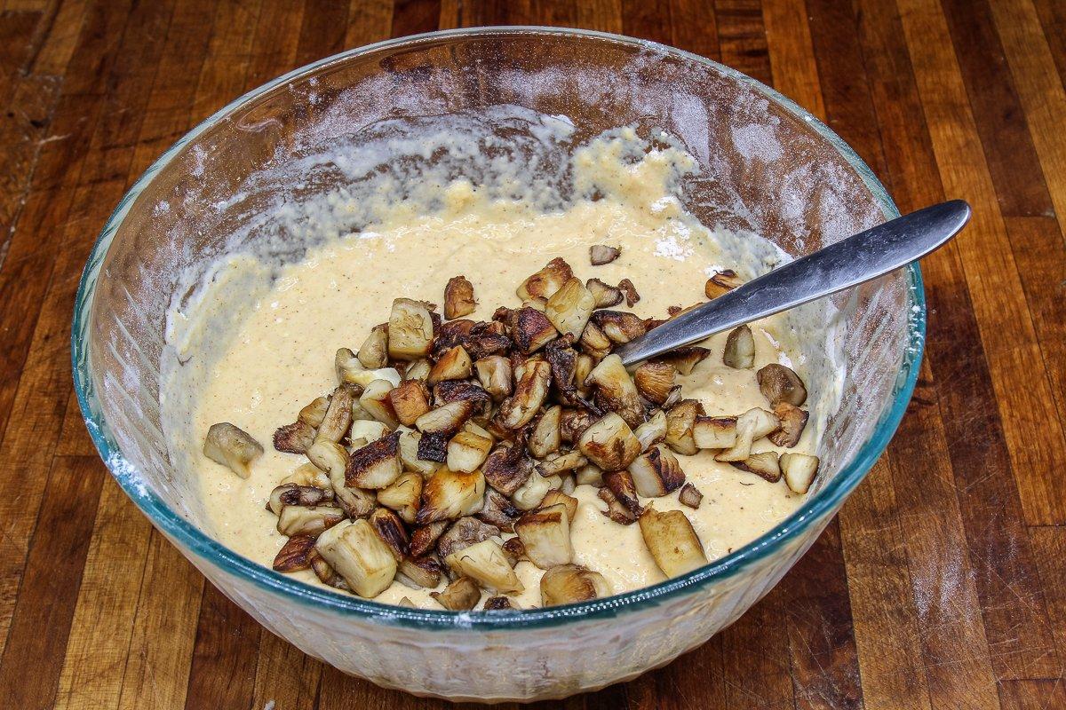 Stir the cooked mushrooms into the thick batter mixture.