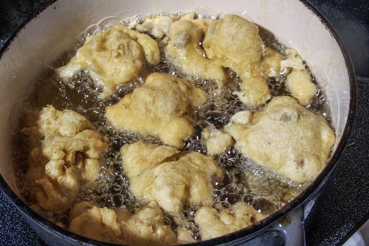 Drop the fritter dough into hot oil a few at a time and cook until golden brown. 