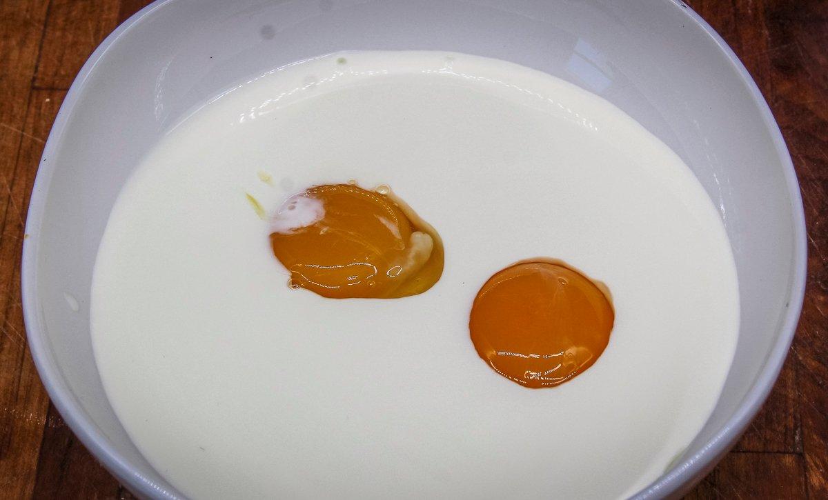 Blend two egg yolks into heavy cream.