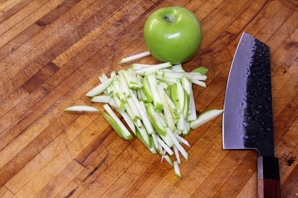 Cut the tart apples into matchsticks.