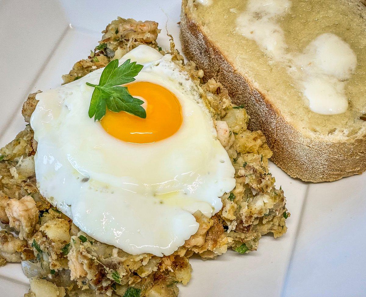 Top the hash with a fried egg and serve with toast.