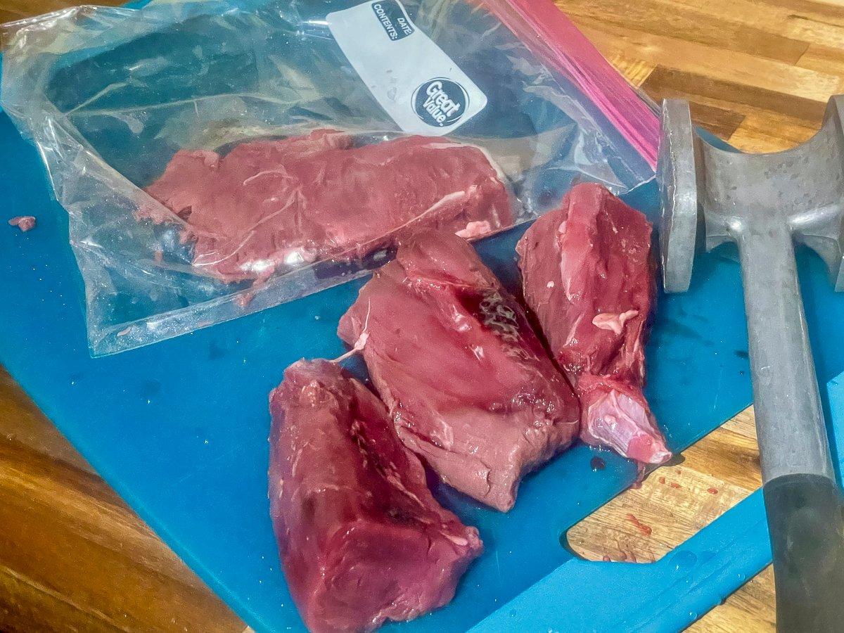 Cut the tenderloin into serving size pieces and pound flat.