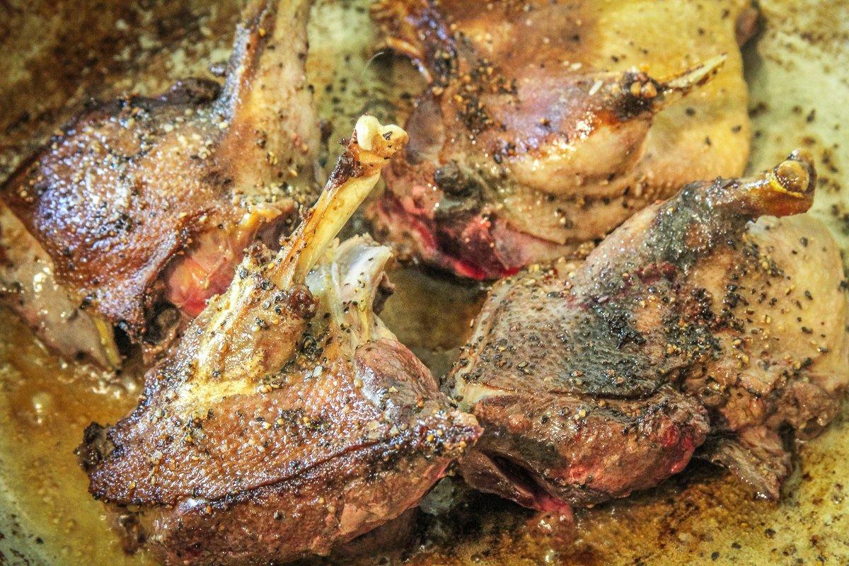 Sear the duck in a hot skillet to crisp the skin.