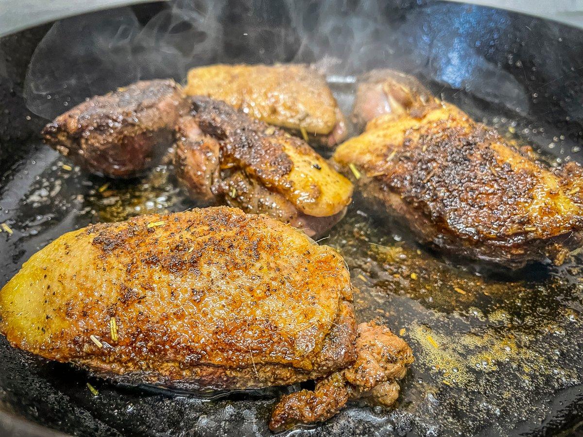 Sear the duck breasts on both sides, then remove from the pan and hold under foil.