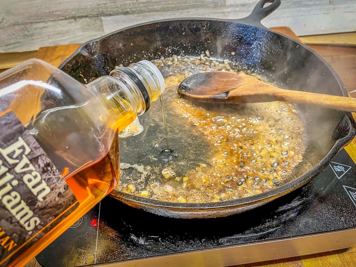 Cook the shallots in pan drippings and butter, then add the bourbon and jam.