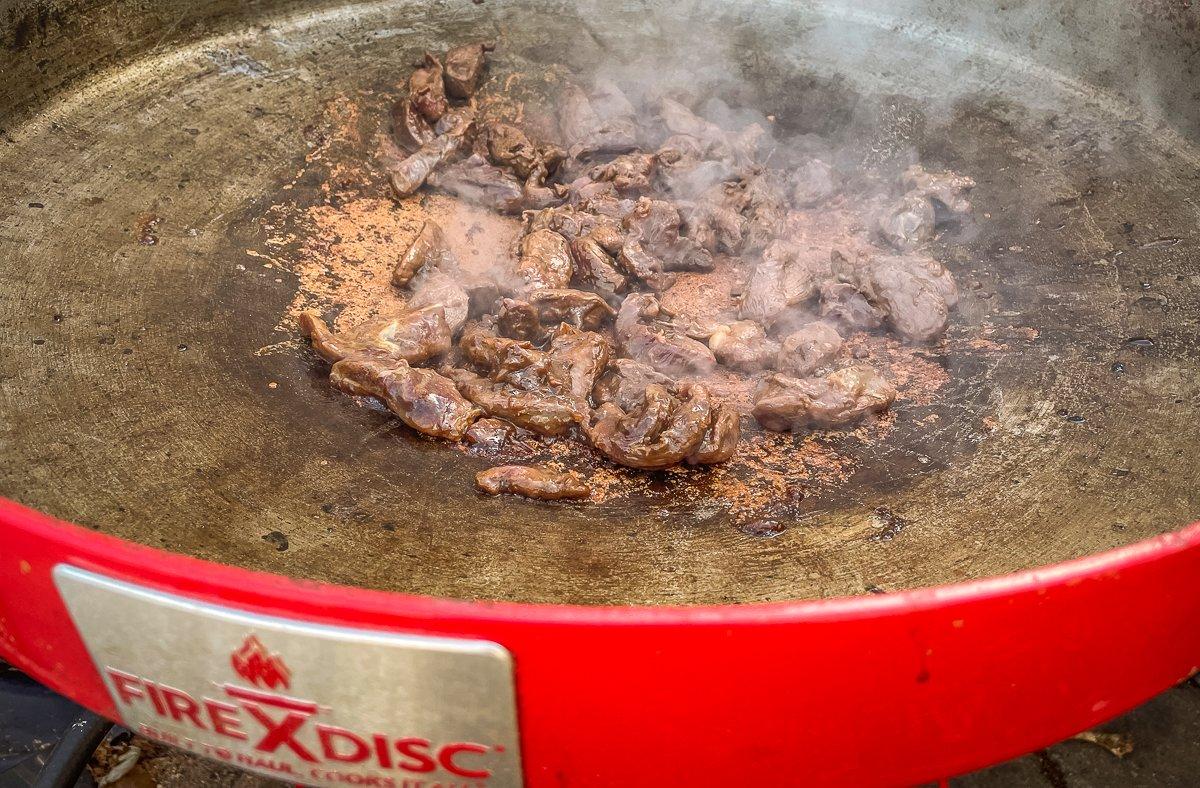 Stir fry the duck over high heat to rare, then move to the outer edge away from the heat.