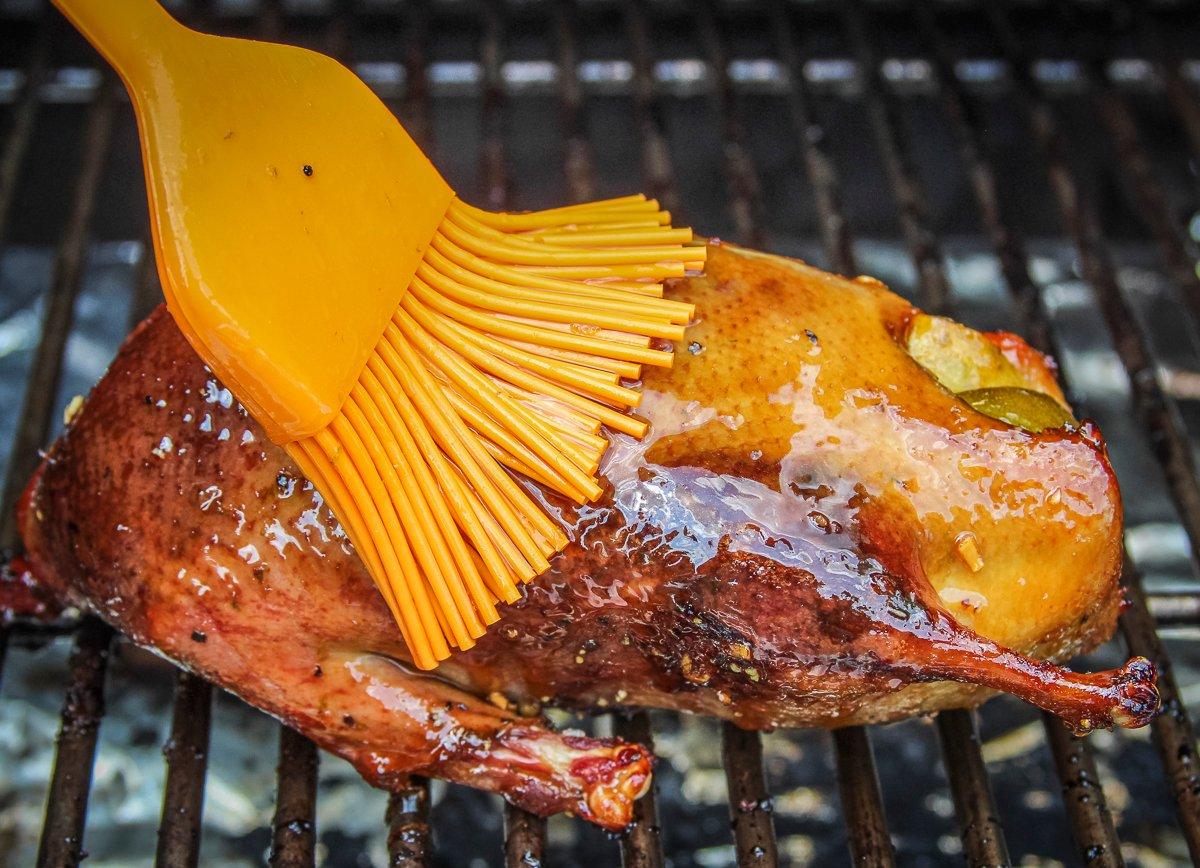 Brush the glaze over the duck several times as it grills.