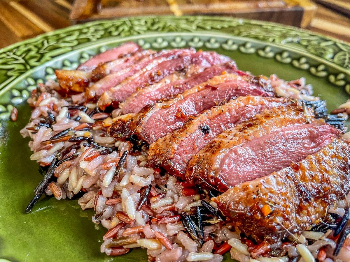 Slice the grilled breasts and serve over a bed of your favorite rice blend.