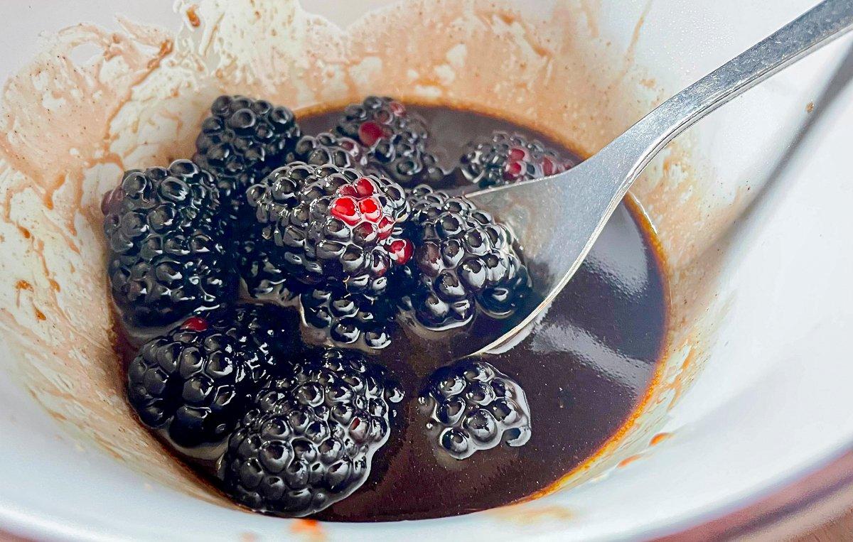 Add fresh blackberries to the warm sauce.