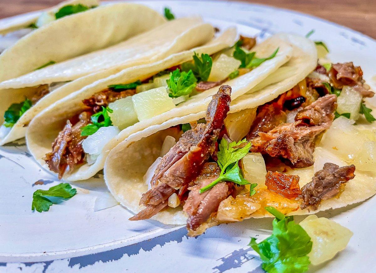 Serve the tacos in warm flour or corn tortillas as an appetizer or main course.