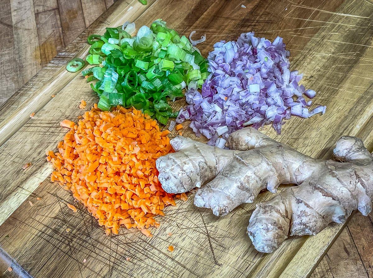 Give the aromatics a fine chop and grate the fresh ginger.