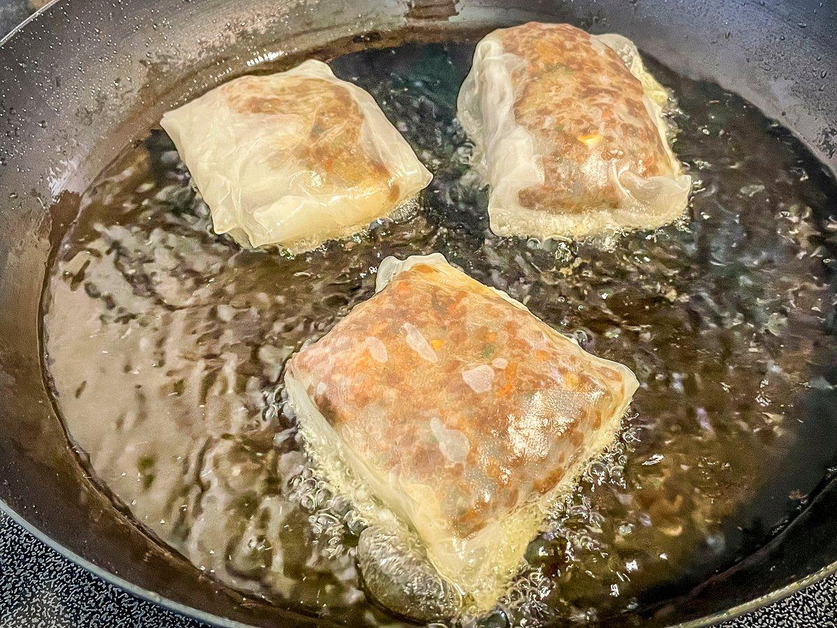 Don't allow the dumplings to touch in the pan to prevent the wrappers from sticking to each other.